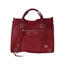 Bolso Velo con borde metálico dorado de Balenciaga en color burdeos
