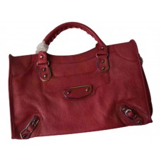 Bolso urbano iridiscente con borde metálico clásico de Balenciaga en color burdeos